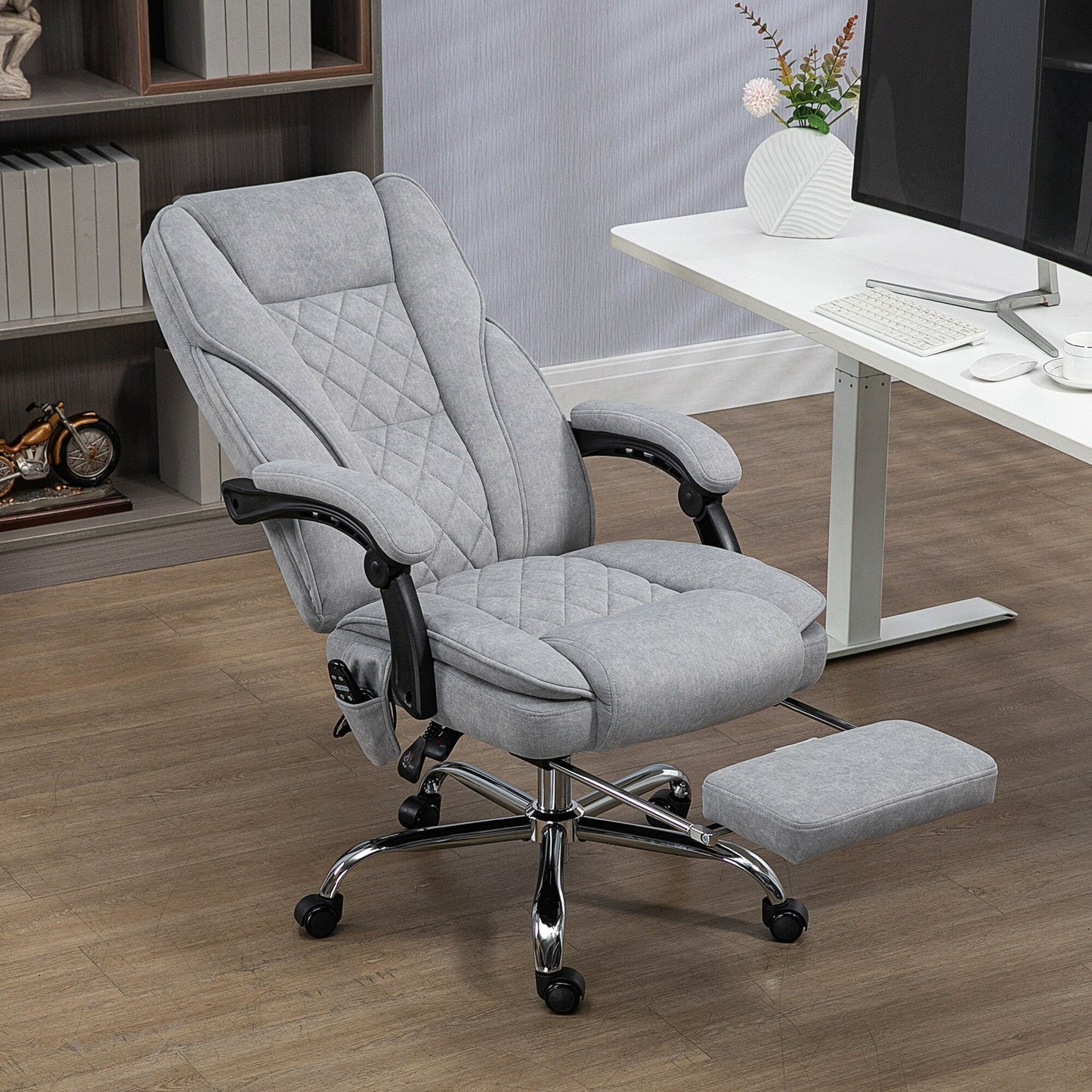 Fauteuil de bureau inclinable et ergonomique avec massage par vibrations à 6 points, pivotant et chauffant pour les lombaires, avec repose-pieds et hauteur réglable.