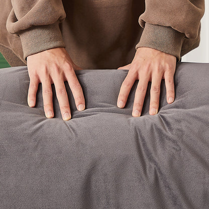 Canapé inclinable 3 places en velours avec 2 coussins, structure en bois massif et ressorts sinueux.