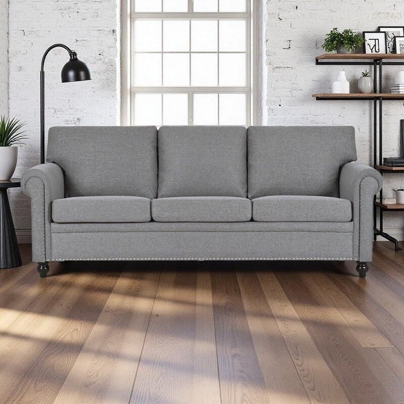 Canapé 3 places en tissu à accoudoirs enroulables, assise à ressorts ensachés, dossier en mousse PP et structure en bois massif (83,86 €)