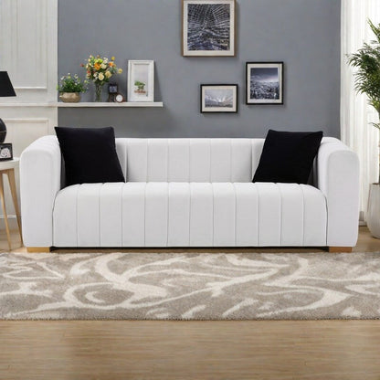 Canapé 3 places en velours 88 avec mains courantes rondes et pieds en métal doré