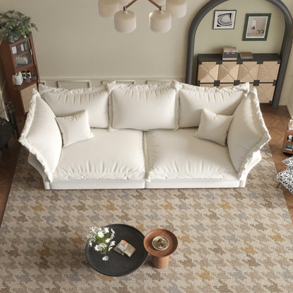 Canapés modernes à assise profonde avec plusieurs grands coussins moelleux