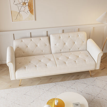 Un canapé-lit de 69,7 pouces de long recouvert de tissu en velours beige, avec une bordure en tête de clou et accompagné d'un coussin assorti