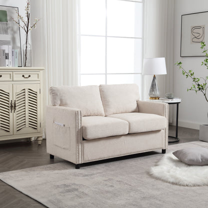 Canapé causeuse en chenille beige avec poche et clous décoratifs