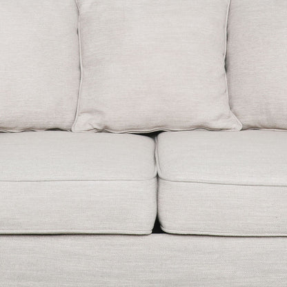 Canapé causeuse beige rembourré avec coussins et pieds en bois