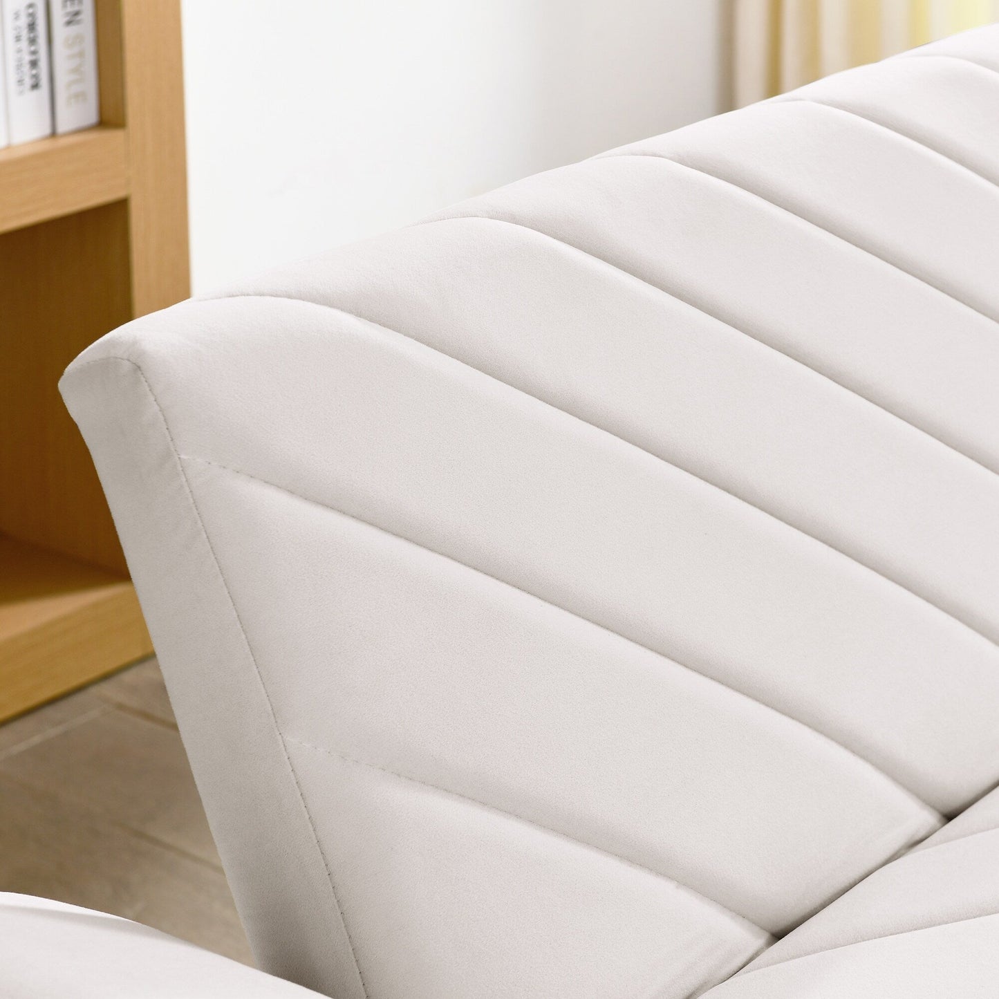 Canapé-lit futon convertible capitonné en velours beige