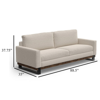 Canapé Bery, piètement moderne en pin massif, polyester beige clair doux