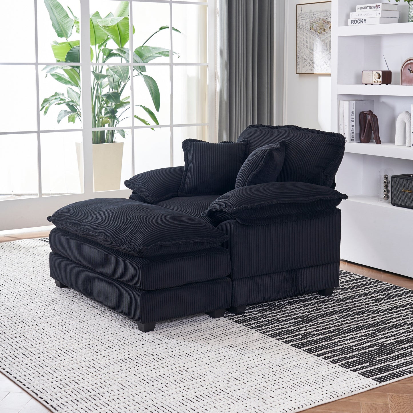 Canapé simple profond en velours côtelé noir avec pouf