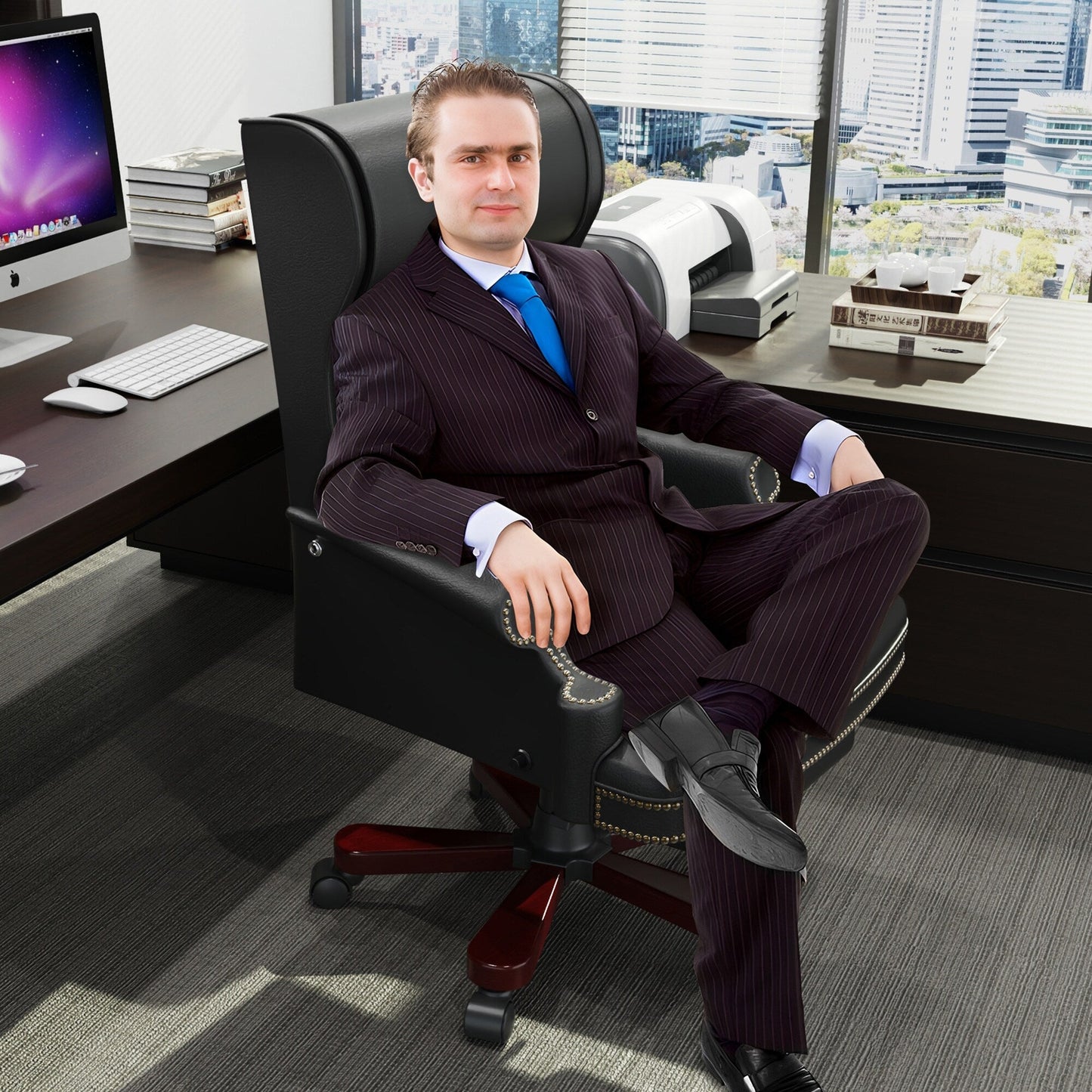 Fauteuil de bureau pivotant ergonomique en similicuir noir avec repose-pieds, dossier capitonné et décoration cloutée