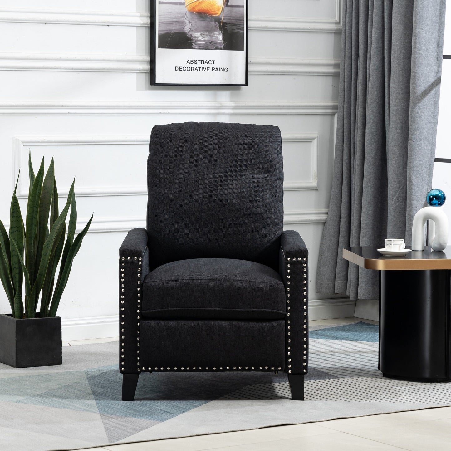 Fauteuil inclinable manuel moderne en velours noir avec coussins et décoration cloutée
