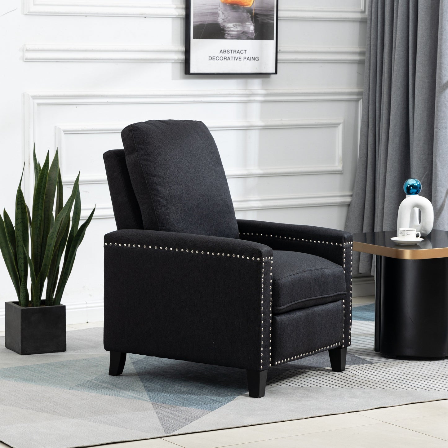 Fauteuil inclinable manuel moderne en velours noir avec coussins et décoration cloutée