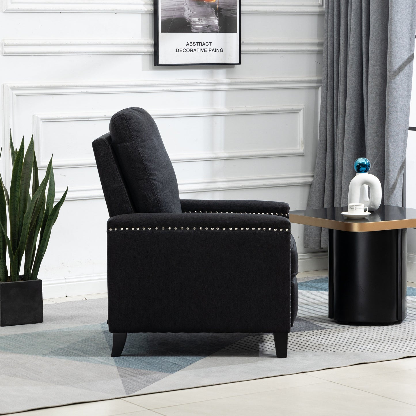 Fauteuil inclinable manuel moderne en velours noir avec coussins et décoration cloutée