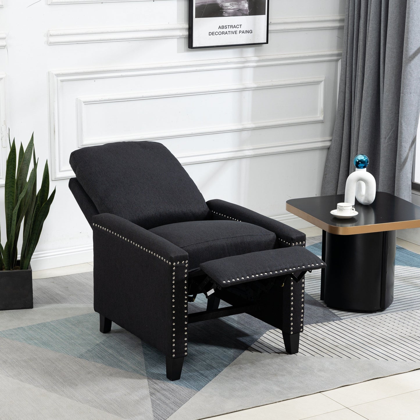 Fauteuil inclinable manuel moderne en velours noir avec coussins et décoration cloutée