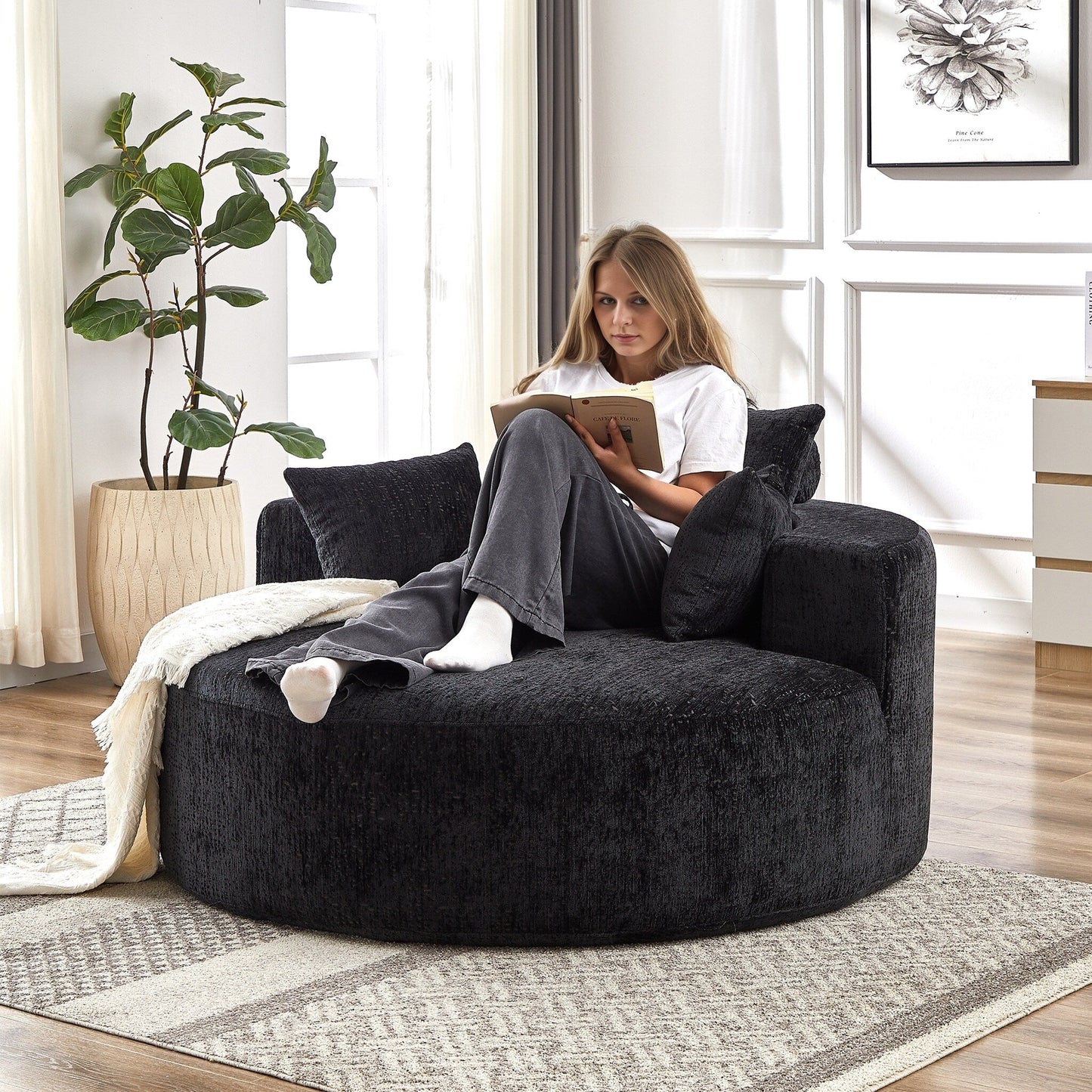 Canapé-lit simple rond en chenille noire avec coussin de dossier