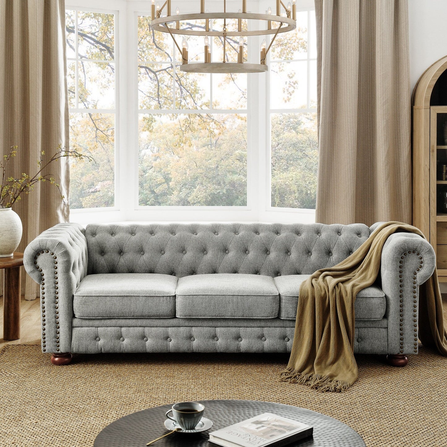 Canapé Chesterfield capitonné 3 places en PU avec accoudoirs à volutes et décoration cloutée