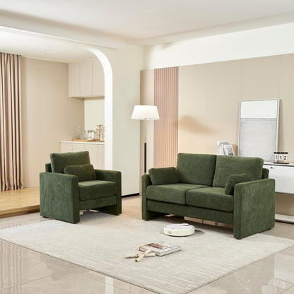 Canapé causeuse en chenille verte avec coussins de dossier et oreillers