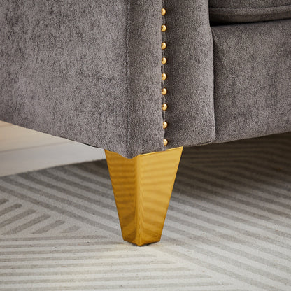 Canapé capitonné 3 places en chenille grise avec décoration cloutée en cuivre