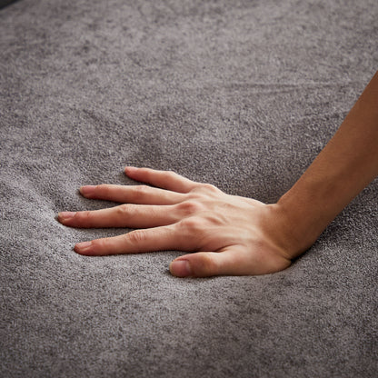 Canapé capitonné 3 places en chenille grise avec décoration cloutée en cuivre