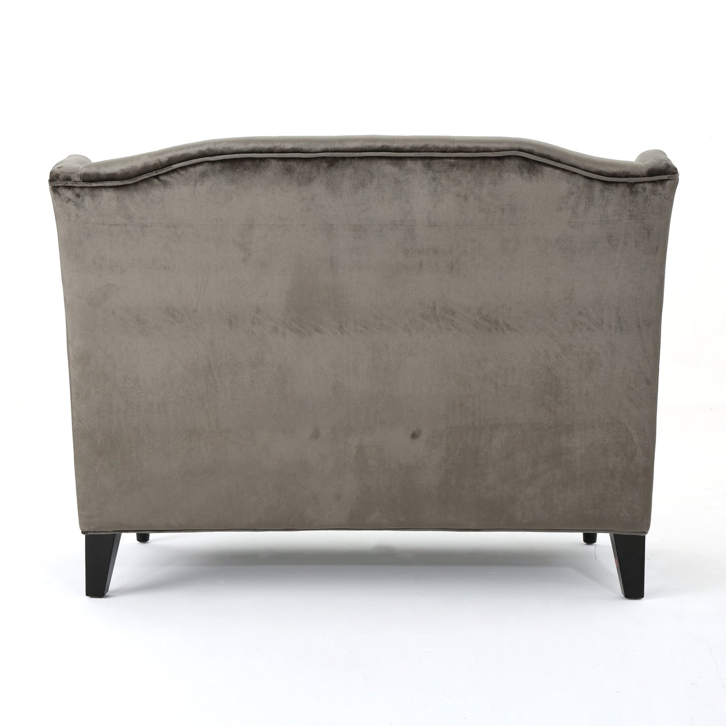 Canapé à oreilles hautes capitonné en velours gris