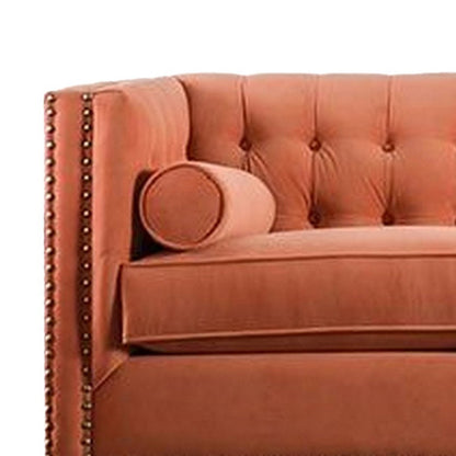 Canapé Leone, capitonné orange, 2 coussins traversins, garniture cloutée, 236 cm