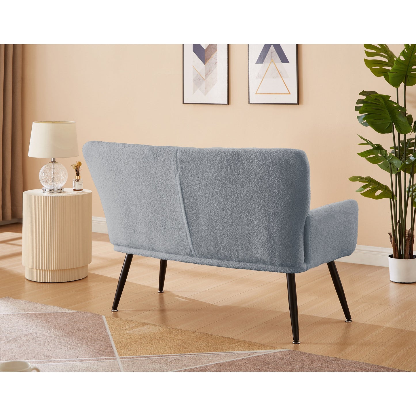 Canapé causeuse Teddy bleu clair 52 avec dossiers matelassés et cadre en bois dur pour le salon.