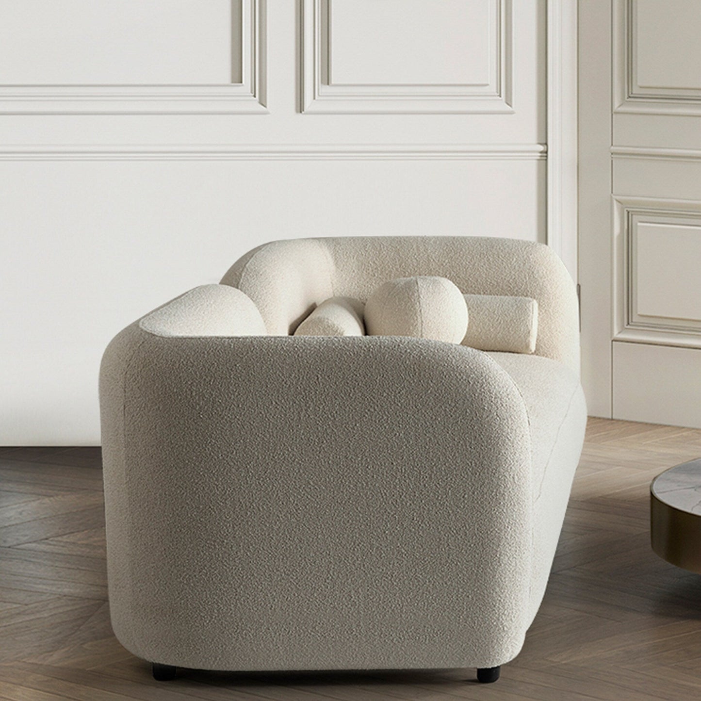 Canapé Milet de luxe moderne en tissu bouclé avec accoudoirs incurvés