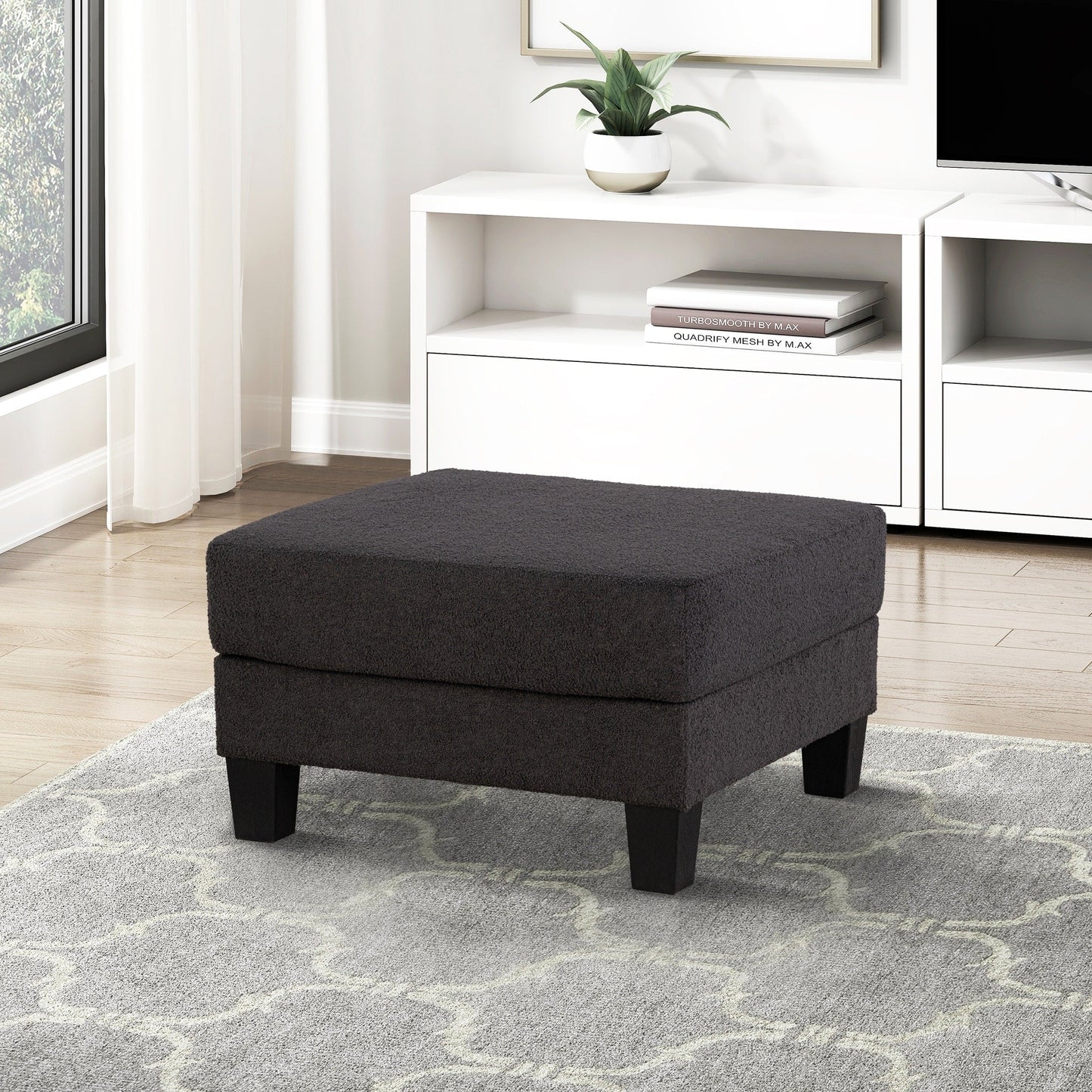 Pouf moderne en tissu noir avec fonction de rangement