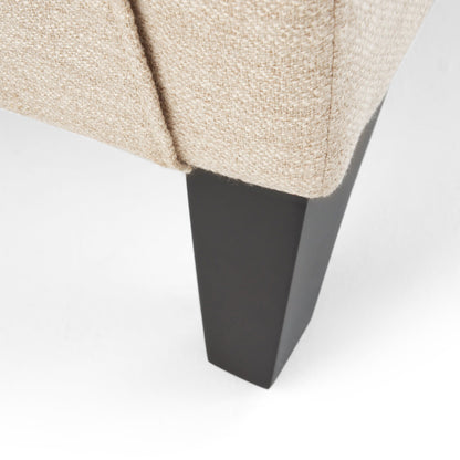 Fauteuil inclinable moderne en tissu avec repose-pieds, détails cloutés et pieds en bouleau