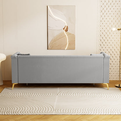 Canapé moderne en velours capitonné, canapé 3 places style milieu de siècle, pieds et coussins en métal doré, élégant canapé de style Chesterfield.