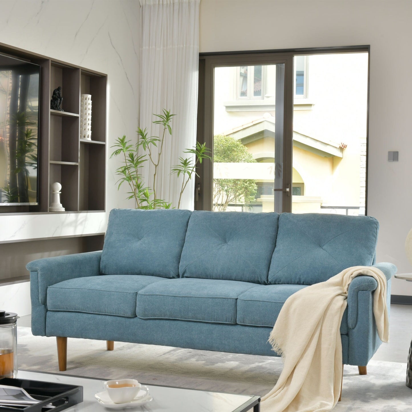 Canapé d'intérieur OVIOS Rive Design avec coussin et pieds en bois