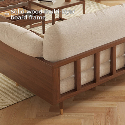 Canapé rectangulaire trois places Romision en lin beige avec accoudoirs évasés