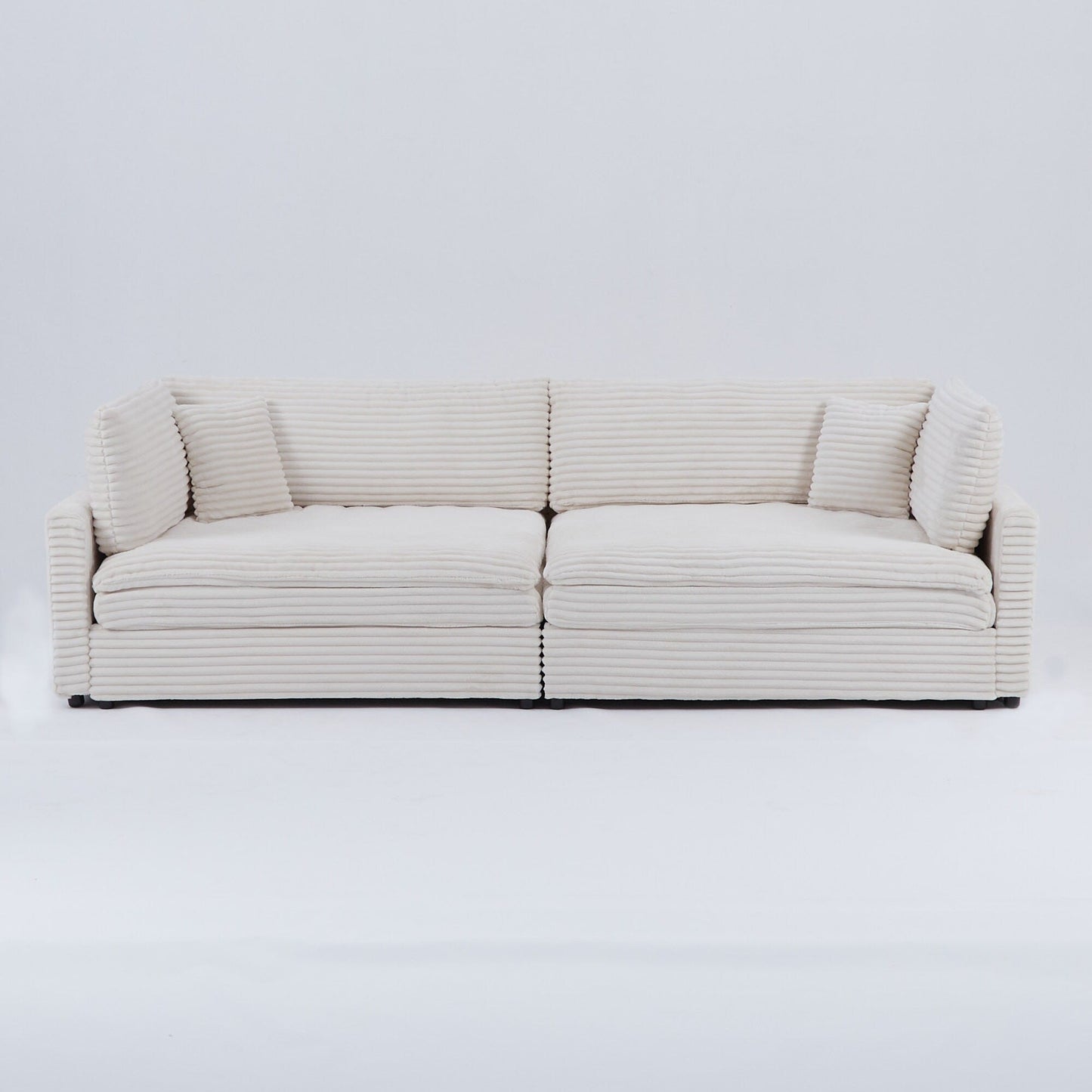 Le canapé en velours côtelé de 112 pouces, avec deux coussins et quatre dossiers