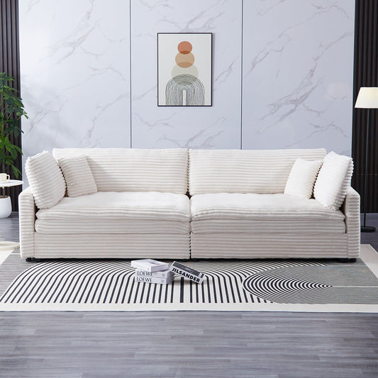 Le canapé en velours côtelé de 112 pouces, avec deux coussins et quatre dossiers