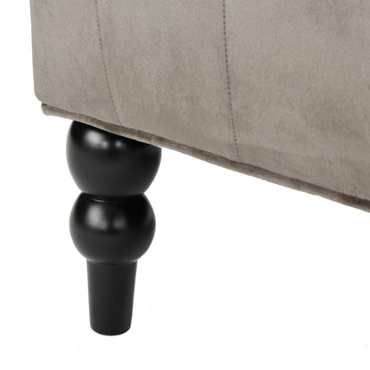 Canapé à oreilles hautes capitonné à boutons en velours